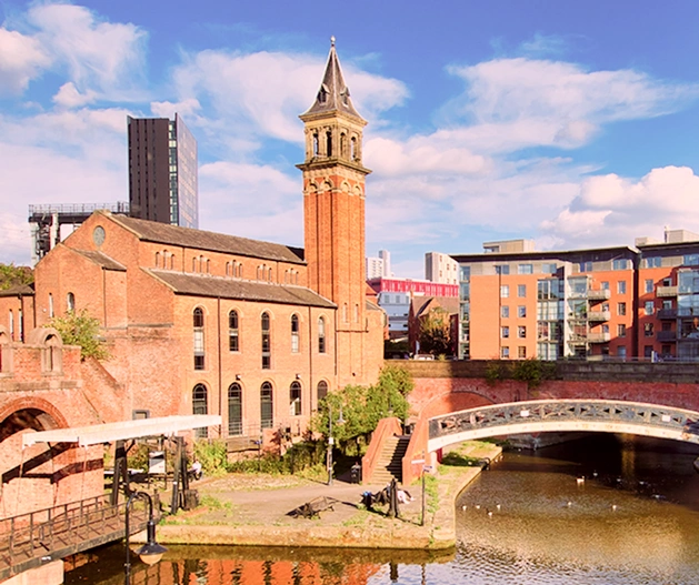 Manchester stadium at night with light trails