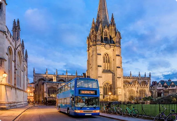 Oxford Tour bus on cobblestone street