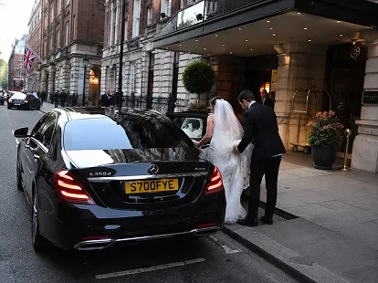 Wedding guests boarding a minibus